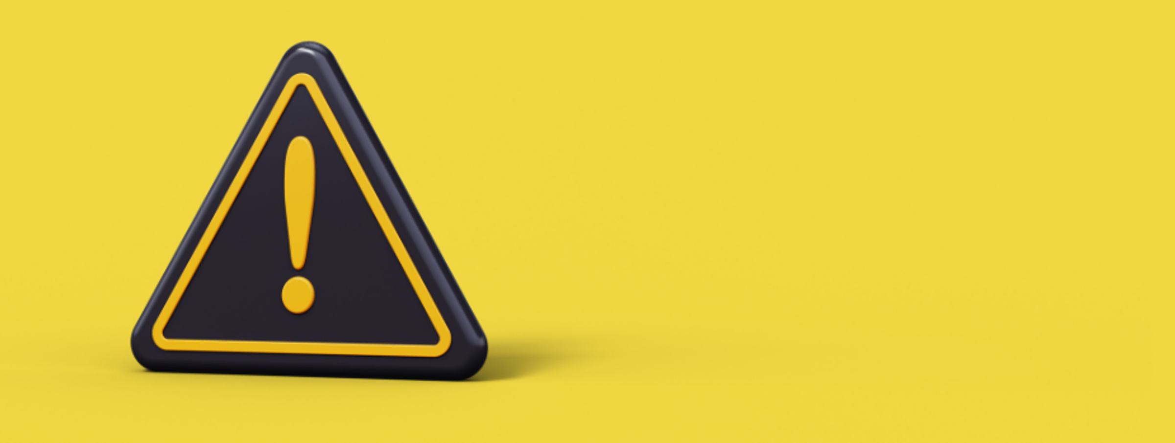 Černý vykřičník na žlutém pozadí
